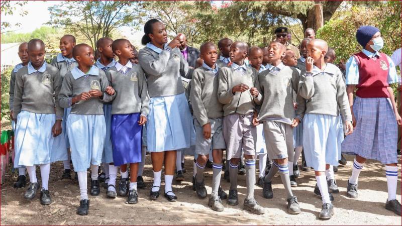 Defence CS Soipan Tuya with pupils in Narok.